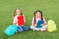 School friends girls study outdoors, doing homework concept