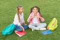 School friends girls study outdoors, open air classes concept