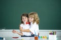 School friends hugging. Two school kids, girl and boy holding hands going at school class in classroom. Two primary Royalty Free Stock Photo