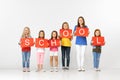 School. Group of children with red banners isolated in white Royalty Free Stock Photo