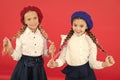 School friendship. On same wave. Schoolgirls wear formal school uniform. Children beautiful girls long braided hair