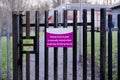 School gate to keep shut sign in grounds for security to children Royalty Free Stock Photo