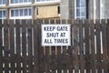 School gate to keep shut sign in grounds for security to children Royalty Free Stock Photo