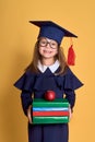 Little girl kid in academician clothes with book Royalty Free Stock Photo