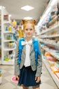 School girl with backpack in stationery store Royalty Free Stock Photo