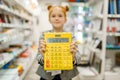 School girl with calculator, stationery store Royalty Free Stock Photo