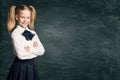 School Girl Child on Blackboard Background, Happy Pupil Kid in Retro Dress over Black Board