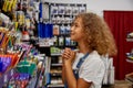 School girl choosing pen at stationery store preparing for new education year Royalty Free Stock Photo