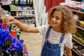 School girl choosing pen at stationery store preparing for new education year Royalty Free Stock Photo