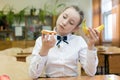 Girl in school uniform chooses food for lunch Royalty Free Stock Photo