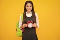 School girl and education concept. Back to school. Schoolchild, teenage student girl with clock alarm, time to study Royalty Free Stock Photo