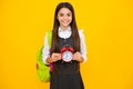 School girl and education concept. Back to school. Schoolchild, teenage student girl with clock alarm, time to study Royalty Free Stock Photo