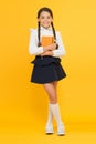 School girl formal uniform hold book. School lesson. Study literature. Towards knowledge. Learn following rules. Welcome