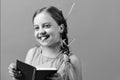 School girl with happy smiling face isolated on blue background Royalty Free Stock Photo