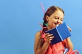 School girl with happy smiling face isolated on blue background Royalty Free Stock Photo