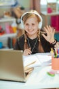 School girl having distance education at home in sunny day Royalty Free Stock Photo