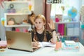 School girl having distance education at home in sunny day Royalty Free Stock Photo