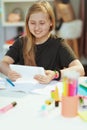 School girl having distance education at home in sunny day Royalty Free Stock Photo