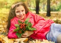 School girl holding bouquet of orange ashberries Royalty Free Stock Photo