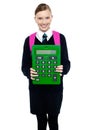 School girl holding large green calculator Royalty Free Stock Photo