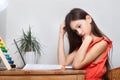 School girl at home on distance education, homeschooling and doing homework at laptop. E-learning, web lesson concept Royalty Free Stock Photo