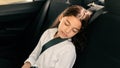 School girl peacefully sleeping in the backseat of a car Royalty Free Stock Photo