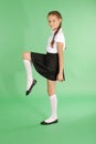 School girl pretty tomboy raising her leg Royalty Free Stock Photo