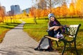 School girl after school in park Royalty Free Stock Photo