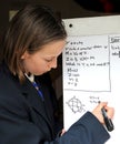 School girl solving maths problem Royalty Free Stock Photo