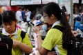 School girl stand with i phone, focus on smartphone after school