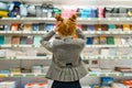 School girl in stationery store, back view Royalty Free Stock Photo