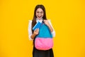 School girl teenager child with book and copybook. Teenager schoolgirl student with backpack, isolated background Royalty Free Stock Photo