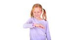 School girl using her smart watch. GPS kids tracker, kids tracking and parental control concept. Studio shot. Royalty Free Stock Photo