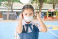 School Girl wearing mouth mask against air smog pollution in Bangkok city, Thailand Royalty Free Stock Photo