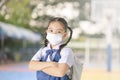 School Girl wearing mouth mask against air smog pollution in Bangkok city, Thailand Royalty Free Stock Photo