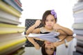 School girl wearing an overall doing homework Royalty Free Stock Photo