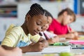 School girl writing in class Royalty Free Stock Photo