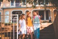 School girls going to home after school. Three little school girls walking and holding hands