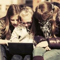 School girls using laptop on the bench Royalty Free Stock Photo