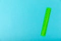 School green ruler on a bright colored background