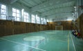 School gym, children and teacher sitting on benches before physical education class Royalty Free Stock Photo