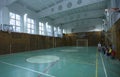 School gym, children and teacher sitting on benches before physical education class Royalty Free Stock Photo