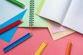 School and hobby concepts. Colored paper sheets, colored pencils and notebooks. Copy space Royalty Free Stock Photo