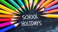 School Holidays: Colorful Pencils on Chalkboard for Educational Fun Royalty Free Stock Photo