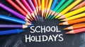 School Holidays: Colorful Pencils on Chalkboard for Educational Fun Royalty Free Stock Photo