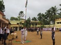 In a School of India Student with Teacher hoist and salute the flag with national anthem