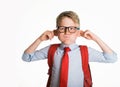 School kid boy making monkey face. Funny silly child boy grimacing isolated on white background. Pupil with big ears Royalty Free Stock Photo