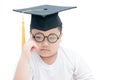 School kid graduate thinking with graduation cap isolated Royalty Free Stock Photo