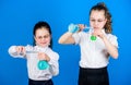 School kid scientist studying science. little smart girls with testing flask. children study chemistry lab. biology