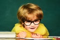 School kids against green chalkboard. Blackboard background. Educational process. School concept. Happy mood smiling Royalty Free Stock Photo